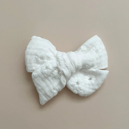 White floral pinwheel bow